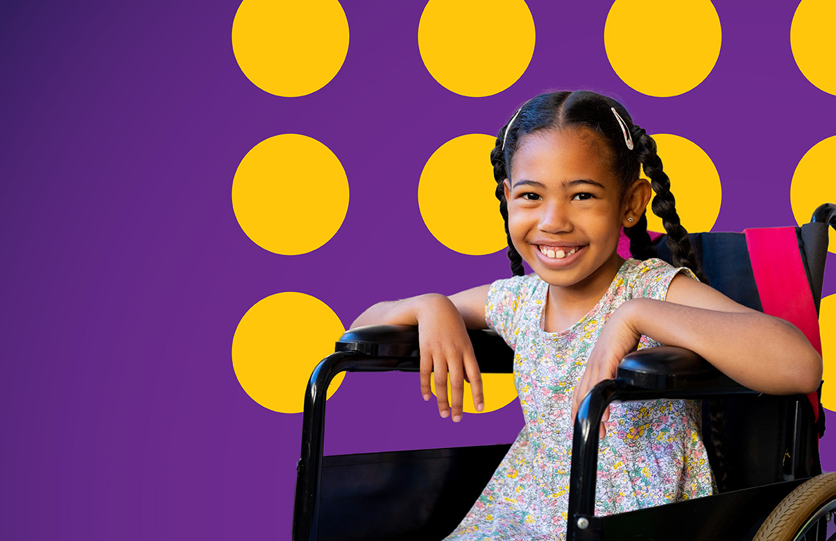 Girl in wheelchair smiling